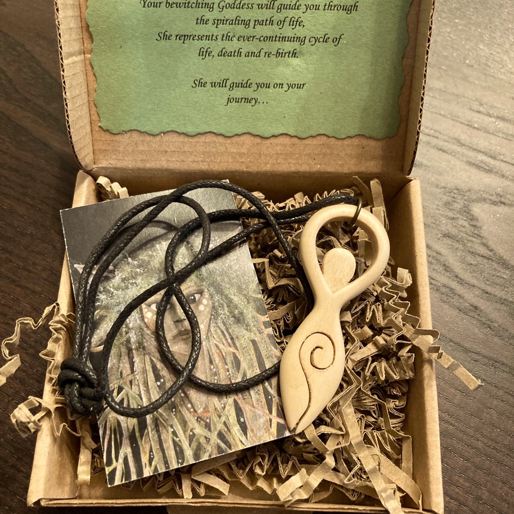 Hand carved wood goddess necklace